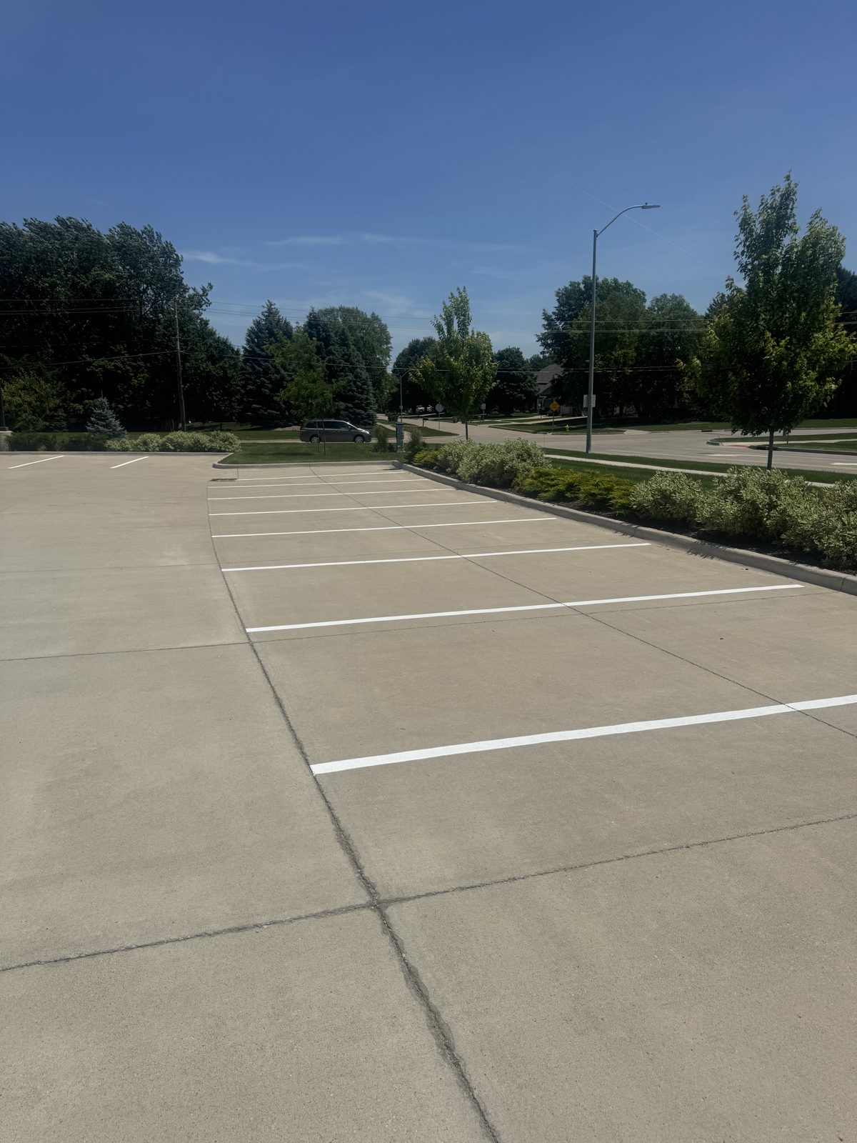 Crisp white parking stall lines after a re-stripe in the Des Moines area