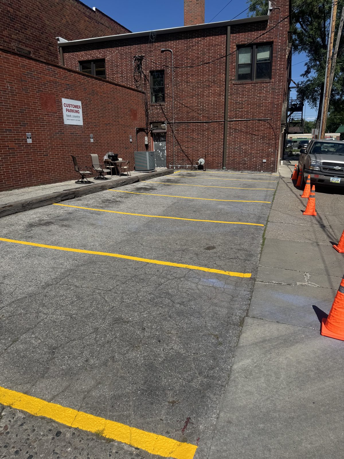 Commercial lot with a brand-new parking layout and bright yellow stall lines in Iowa