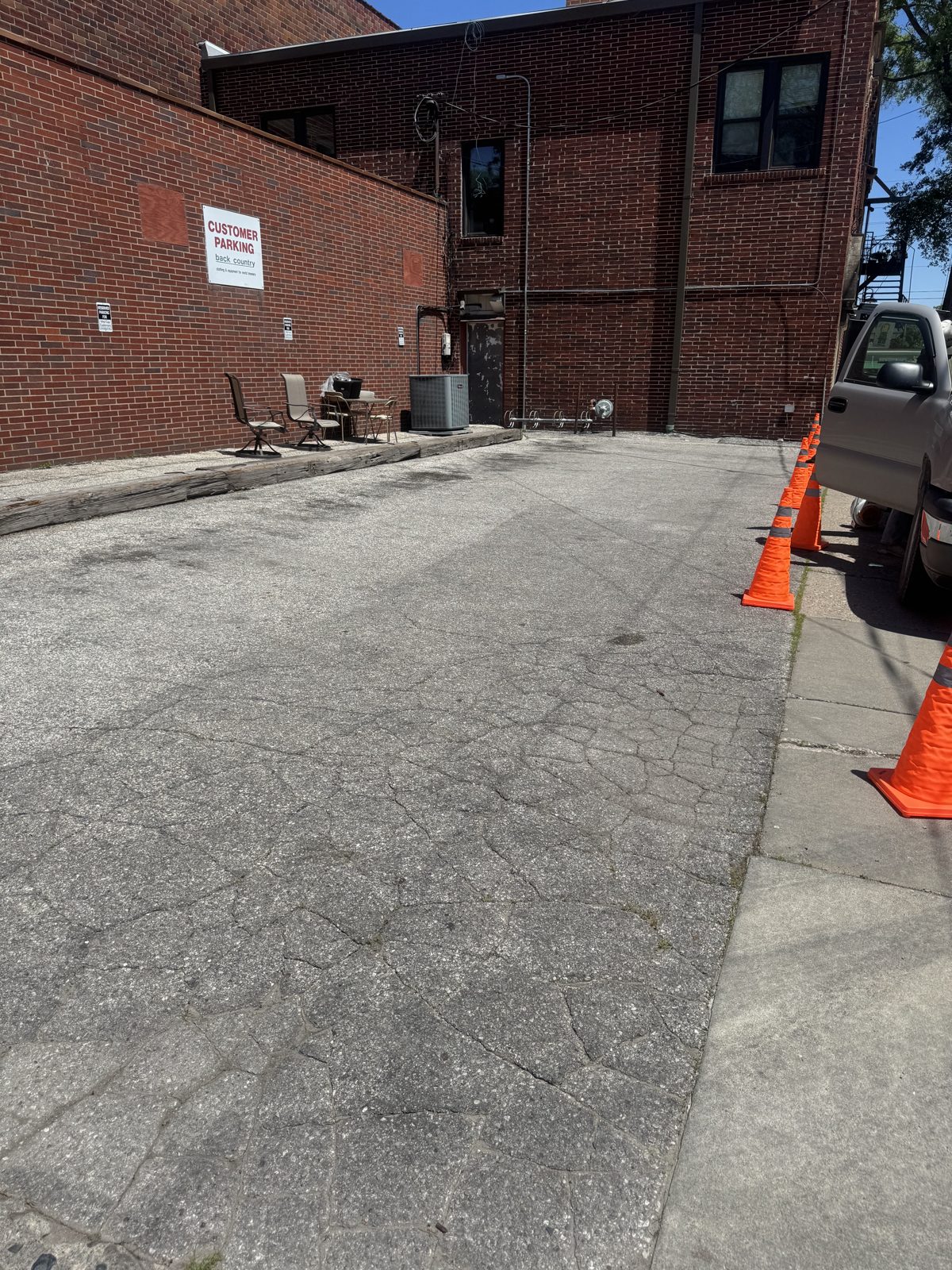 Blank commercial lot with no parking lines before a new layout in Iowa